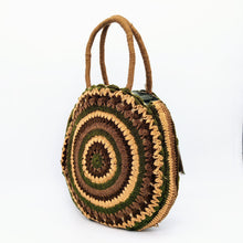 Cargar imagen en el visor de la galería, Bolso redondo de colores de crochet en lana acrílica. Dos asas cortas y otra larga de lana trenzada, de LaNievina. Tonos tierra