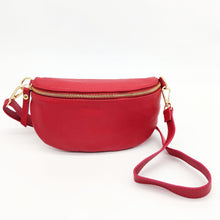 Cargar imagen en el visor de la galería, Bolso tipo riñonera de piel lisa. Cierra con cremallera. Asa larga de piel ajustable. Interior forrado textil, con bolsillo cerrado con cremallera. Tamaño mediano. La Nievina. Vista frontal 
